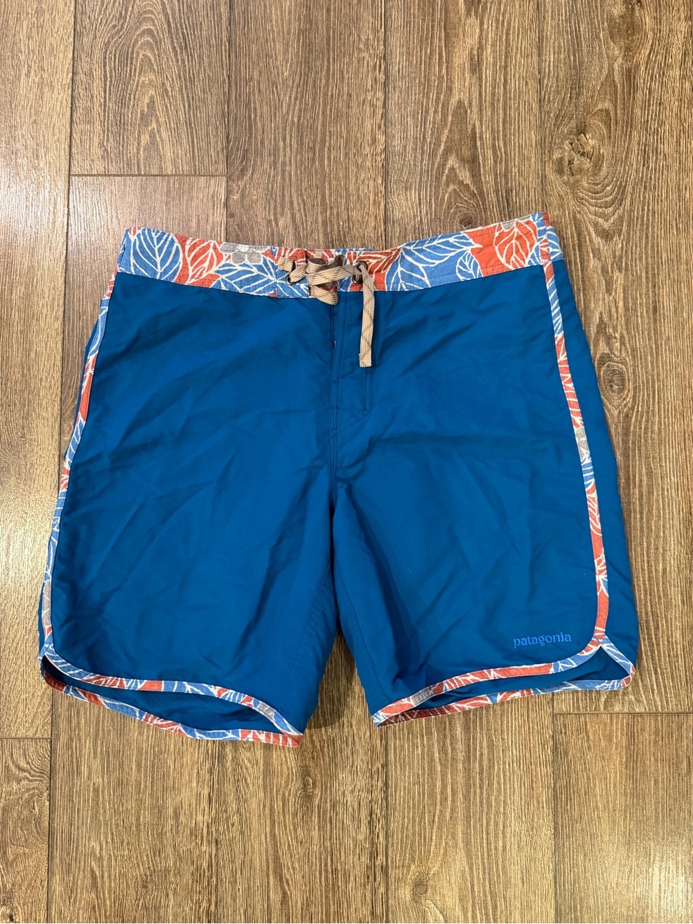 Patagonia Men’s Blue Swim Board Shorts with Orange-Accent Floral Trim